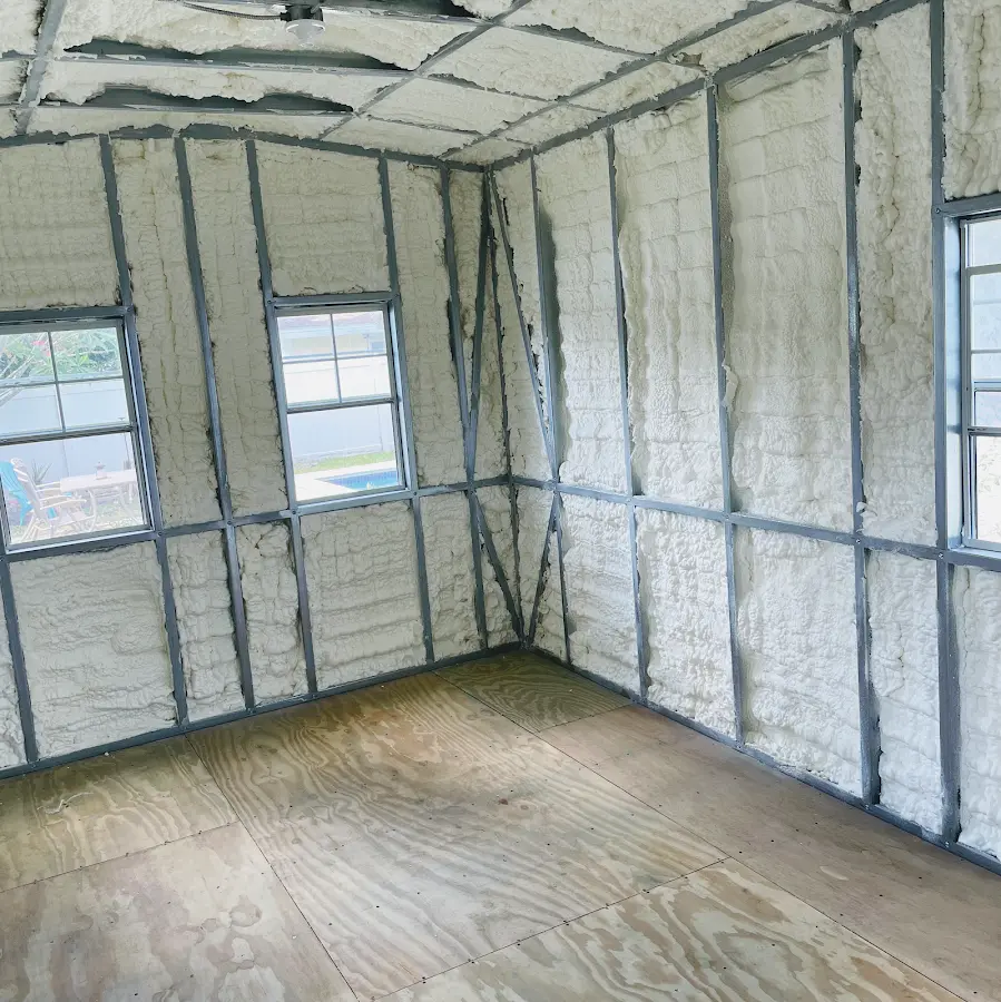 Closed-cell spray foam insulation applied to wall cavities in a residential project in Scott
